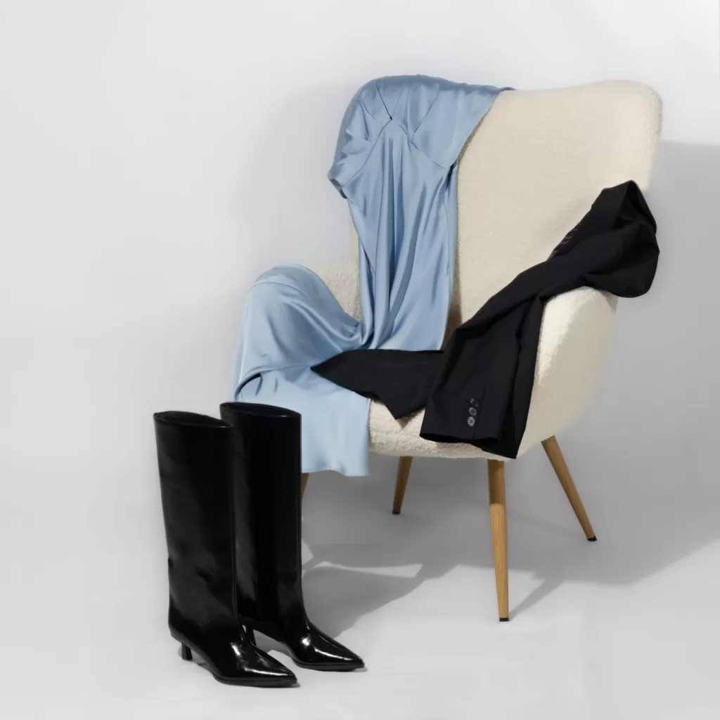 A chair with carefully styled clothes, representing personal styling, personal shopping, and wardrobe consultation services